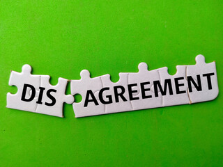 White puzzle with the word DISAGREEMENT