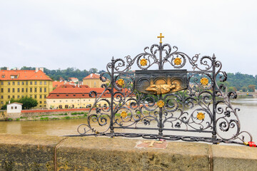 Ancient medieval sculptures on the Charles Bridge. Background with selective focus