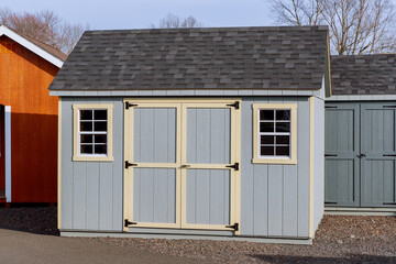 row of demo garden sheds for sale
