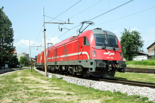 LJUBLJANA, SLOVENIA - JUNE 1, 2008: Slovenian Railways (Slovenske Zeleznice) electric locomotive Series 541 Taurus ready for pulling a cargo train nearLjubljana train station.

Picture of a train belo