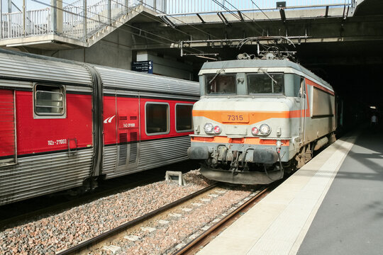 MONTPELLIER, FRANCE - OCTOBER 29, 2006: Intercity Train in Montpellier saint roch train station, belonging to SNCF pulled by a BB 7200 passing by a Talgo train for France Spain traffic.
