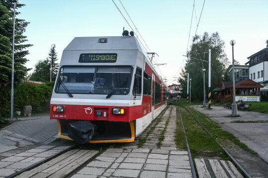 STARY SMOKOVEC, SLOVAKIA - JUNE 9, 2014: Eletric EMU train from ZSSK slovak railways from TEZ, or Tatra Electric Railway, entering the train station of Smokovec in the high tatra mountain.
