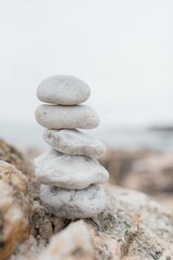stack of white stones on beach for zen meditation relaxation 