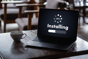 man installing Software Update On Mobile Phone And Laptop digital technology communication