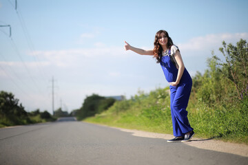 Pregnant woman on the road stops the car