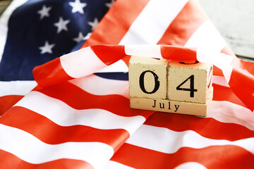 July 4th wooden Stars and Stripes flag on background with flag of the USA. Summer day. Independence...