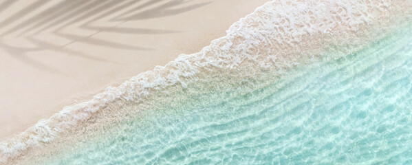 Aerial top view of beautiful tropical white sand beach with wave foam and transparent sea, Summer...