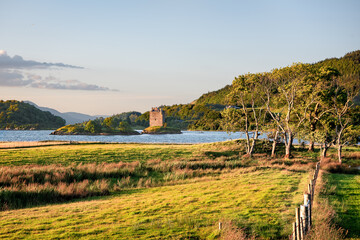 Castle Stalker in Scotland at sunset