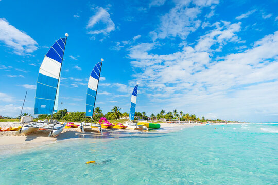 Beautiful seascape with clear turquoise water. sailing ships are parked on the sand. beautiful beach of Varadero in Cuba on a sunny summer day