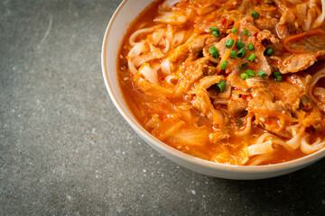 Korean udon ramen noodles with pork in kimchi soup