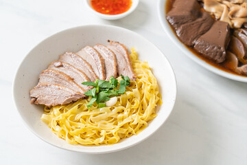 dried duck noodles in white bowl