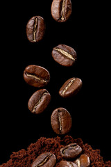 Obraz premium Roasted coffee beans from Colombia suspended in the air, Arabica variety.