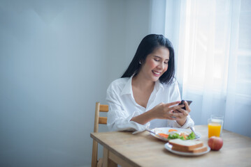 With a smile on her face the girl engaged in a lively conversation with her friend as she spoke on...