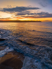 Aerial sunrise seascape with high cloud