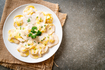 ravioli pasta with mushroom cream sauce and cheese