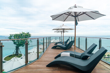 bed pool with umbrella around swimming pool