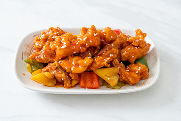fried crispy chicken with sweet and sour sauce