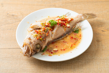 Steamed grouper fish with lime and chillies