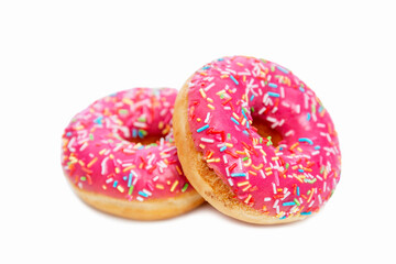 Appetizing donuts with bright pink icing and colorful topping. Sweets and delicious fast food....