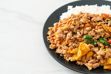 stir-fried minced pork with basil and egg topped on rice