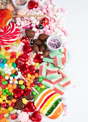 Various sweets assortment. Candy, bonbon, chocholate on white background.