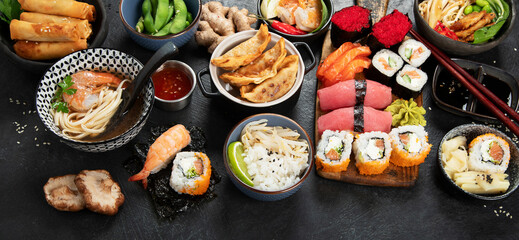 Traditional Japanese food dishes on black background