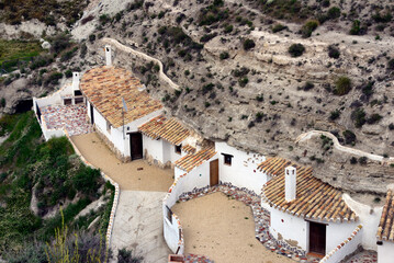 Traditional cavehouses in the city of Galera near Baza, unspoilt cave country in mountainous region of northern Andalusia, Galera, Huéscar, Granada, Andalusia, Spain, Europe - obrazy, fototapety, plakaty