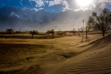 desert in the snow mountains, cold desert and snow peaks, landscape of dune  desert  and snow caped...