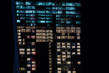 Illuminated windows at night in downtown SIngapore