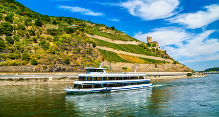 Cruise ship at Ehrenfels Castle in the Upper Middle Rhine Valley. UNESCO world heritage in Germany