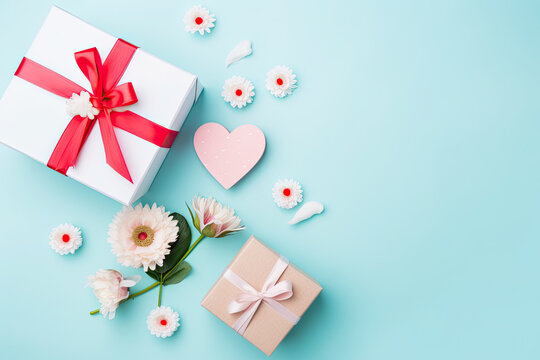 Mom Deserves the Best: Show your appreciation for mom with this beautiful flat lay photo of gift boxes, flowers, and hearts arranged on a pastel blue background. Use this image for your Mother's Day 