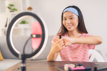 Young woman making a make-up video