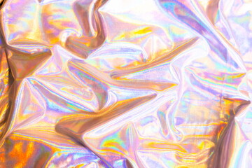 Holographic iridescent mermaid foil texture background. Futurist