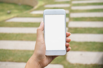 Women's hands holding cell telephone blank copy space screen. smartphone with blank white screen isolated. smart phone with technology concept