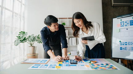 Asian businessman and woman people meeting in office. Employee brainstorm and work as team, plan and discuss project by point on paper and tablet. .