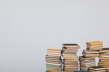 stack of books on a light background science learning library education