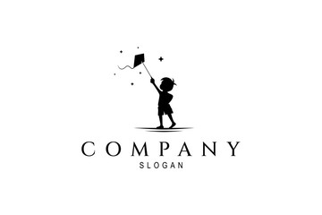 Obraz premium Silhouette logo of little boy playing kite in flat design style