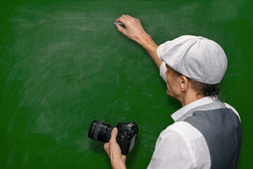 Male teacher explaining different shooting techniques during lesson in photo school