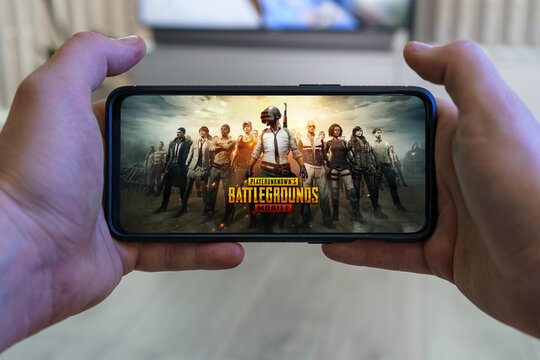 Playing PUBG mobile game. Point of view gaming on smartphone