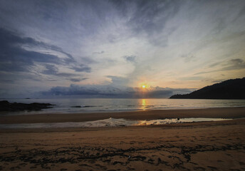 Sunrise at the beach with reflection