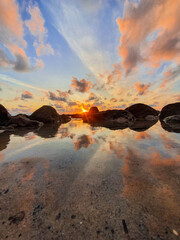 Sunrise at the beach with reflection