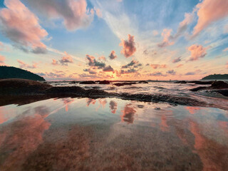 Sunrise at the beach with reflection