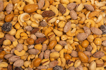A group of almonds, pistachios, walnuts, macadamia, cashews.