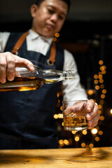 Barman pouring beer glass beautiful night