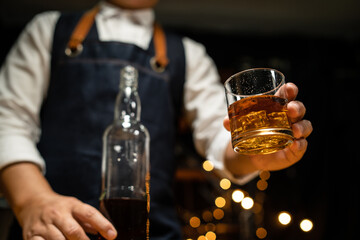 Barman pouring whiskey whiskey glass beautiful night