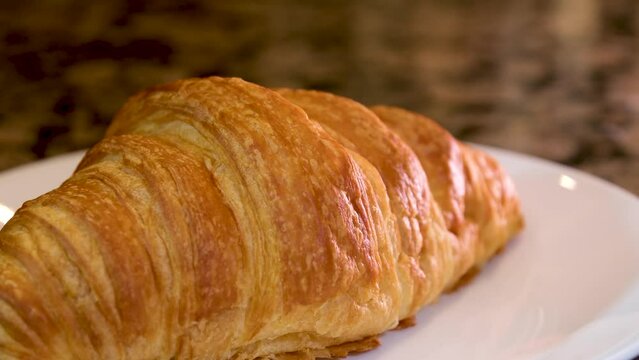 Fresh unfilled croissants for breakfast. High quality 4k footage