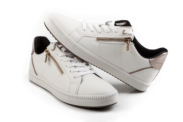 Pair of white sneakers isolated on white background with clipping path.