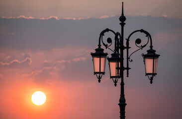 old street lamp at sunset at lake garda italy