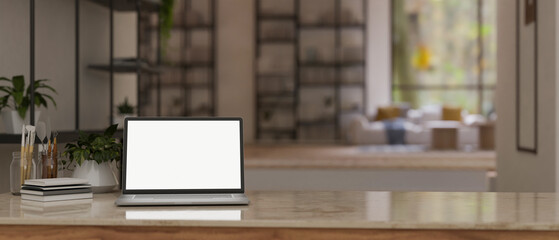 Workspace close-up with laptop mockup and copy space on a tabletop