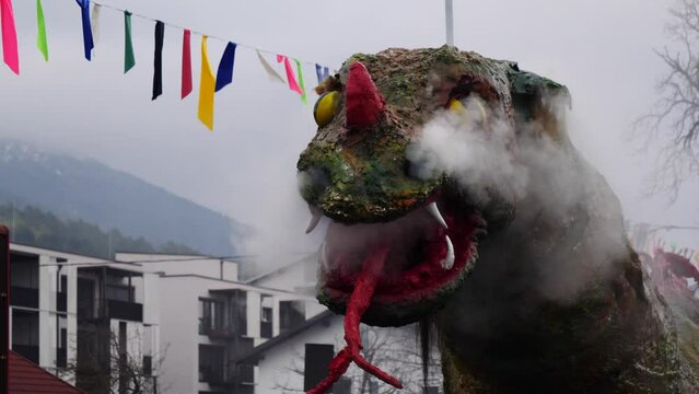 Carnival Pust in Cerknica, Slovenia.  Great dragon mask spewing fire and smoke.